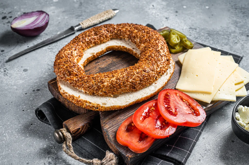 Image of freshly baked Asiago bagels with golden-brown crust and melted cheese topping