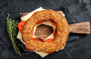 Image of freshly baked Asiago bagels with golden-brown crust and melted cheese topping