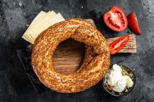 Image of freshly baked Asiago bagels with golden-brown crust and melted cheese topping