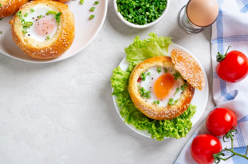 Assorted bagels on a wooden board, highlighting the variety without eggs for dietary considerations.Assorted bagels on a wooden board, highlighting the variety without eggs for dietary considerations.