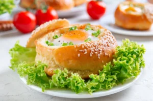 Assorted bagels on a wooden board, highlighting the variety without eggs for dietary considerations.