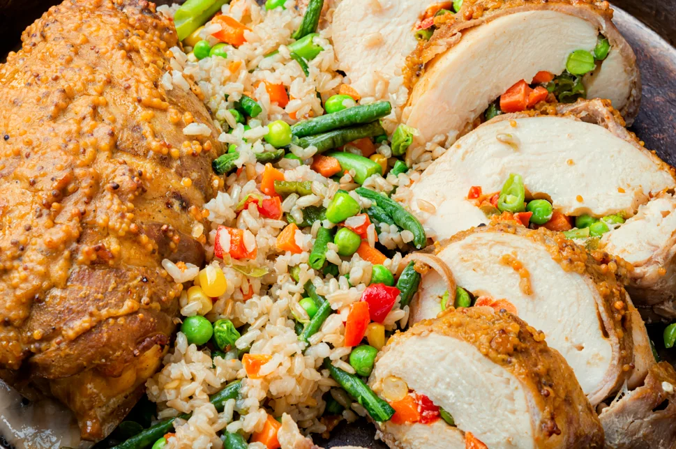 Healthy chicken and brown rice meal on a plate, showcasing a balanced diet option for weight loss