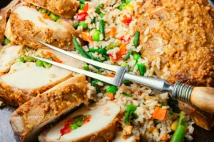 Healthy chicken and brown rice meal on a plate, showcasing a balanced diet option for weight loss