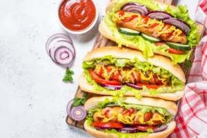 Hot dogs cooking in an air fryer with text overlay 'How Long to Cook Hot Dogs in Air Fryer: Perfect Quick & Easy Cooking Guide